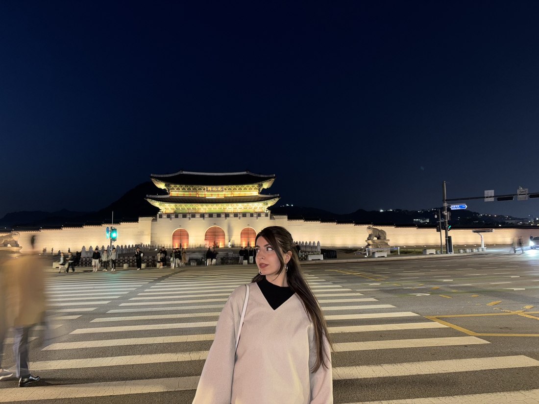 Elena Vargas at night in front of Gyeongbokgung Palace, Seoul